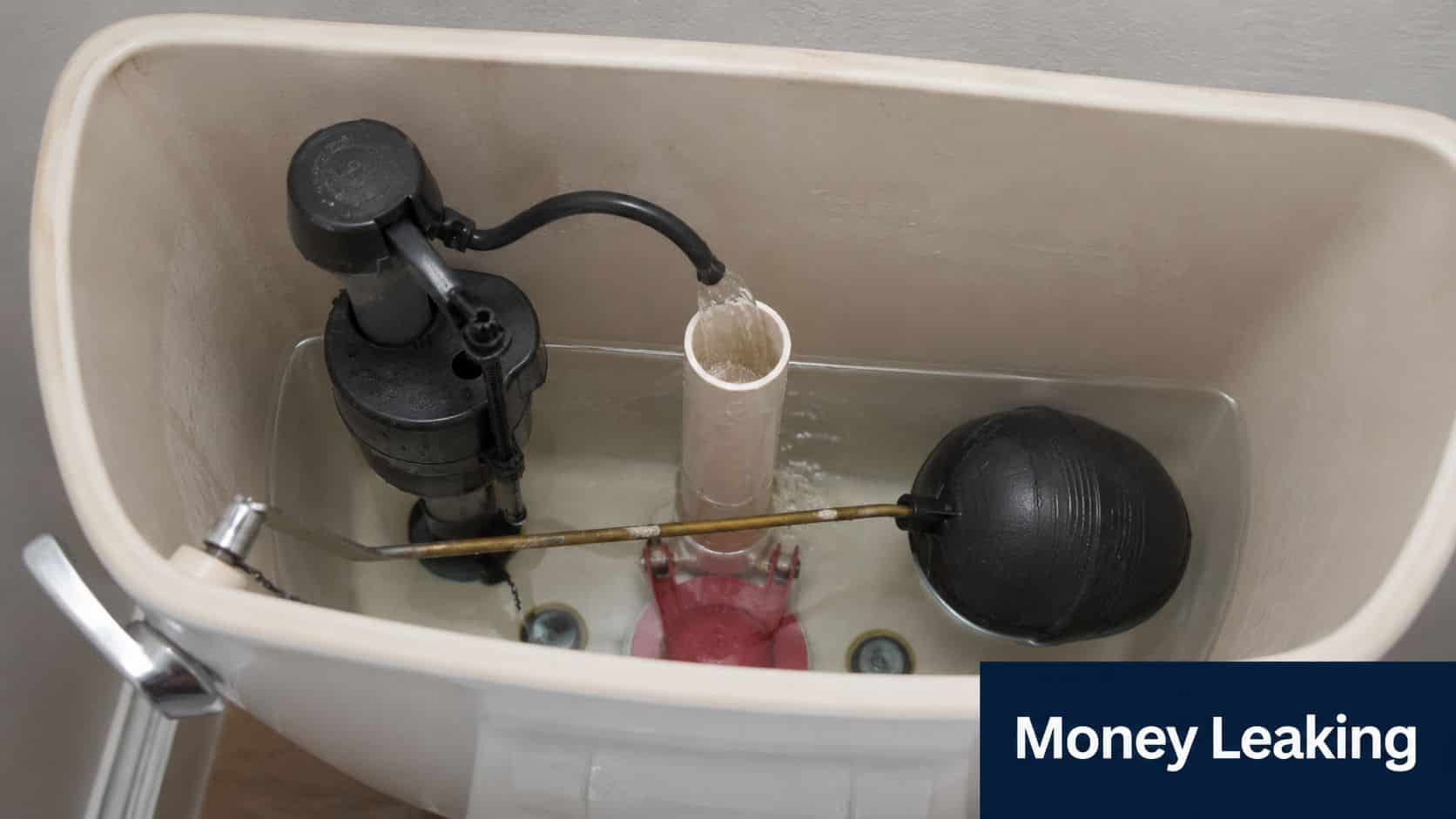 Inside view of an open toilet tank showing water running into the overflow tube, indicating a leak.